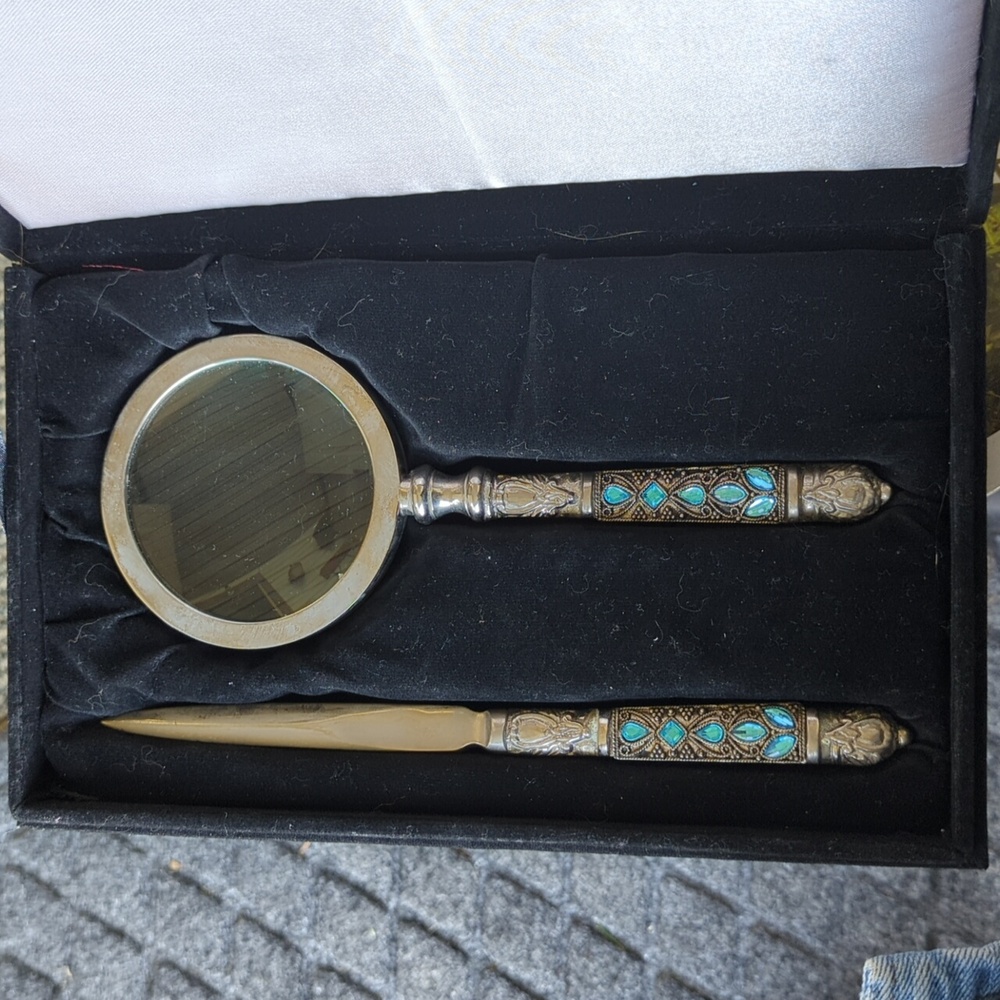 Vintage Silver colored letter opener and matching magnifying glass.